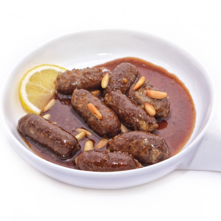 سجق مقلي بدبس الرمان والصنوبر